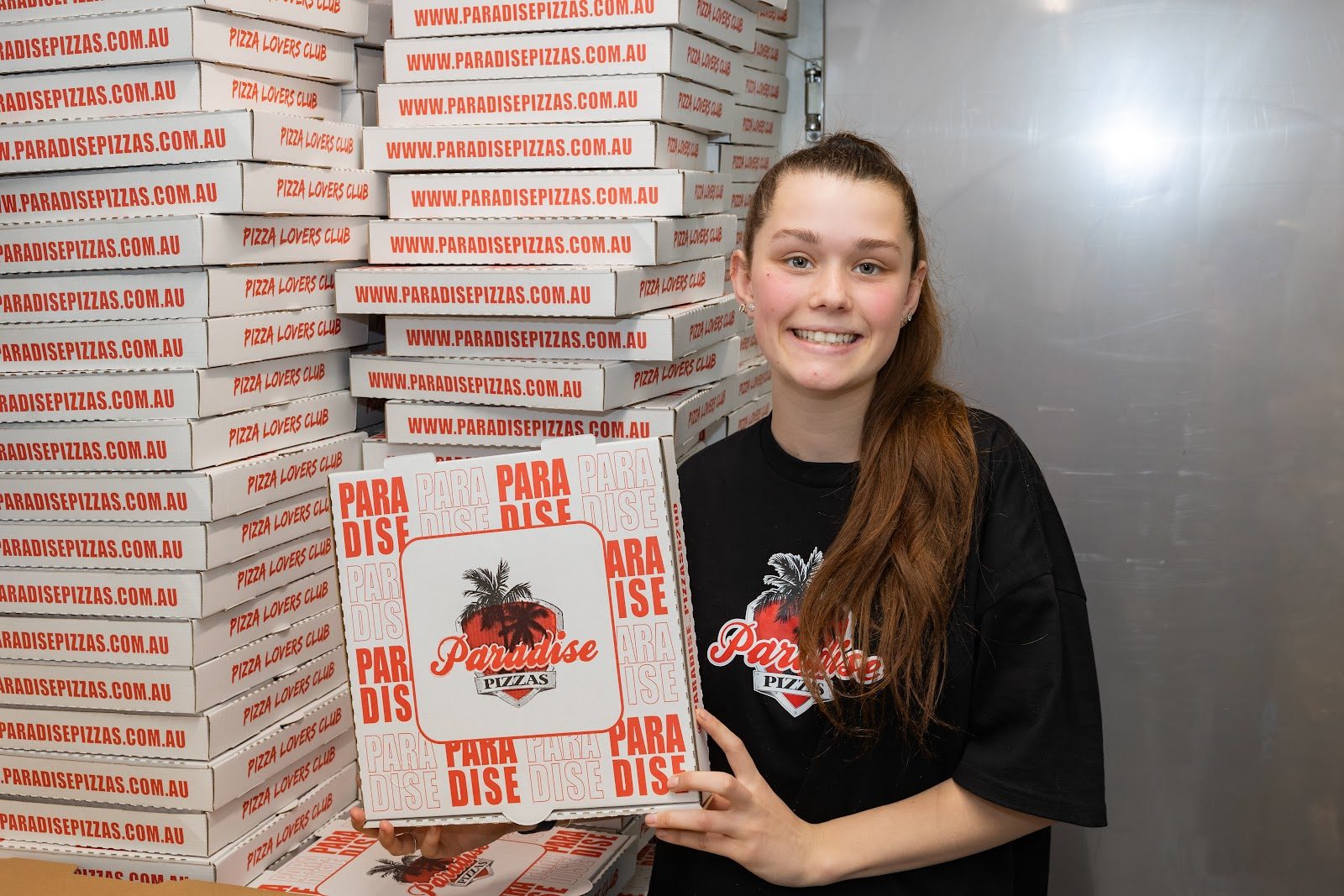 Paradise Pizzas staff with a Pizza Lovers Club box