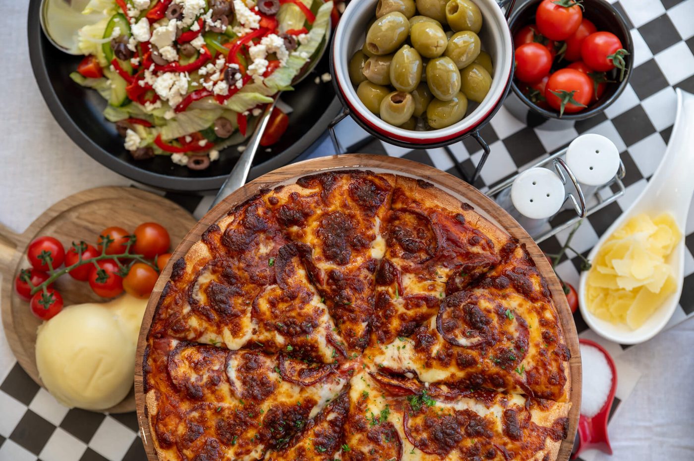 Italian spread — pasta, lasagna and pizza on the Paradise table